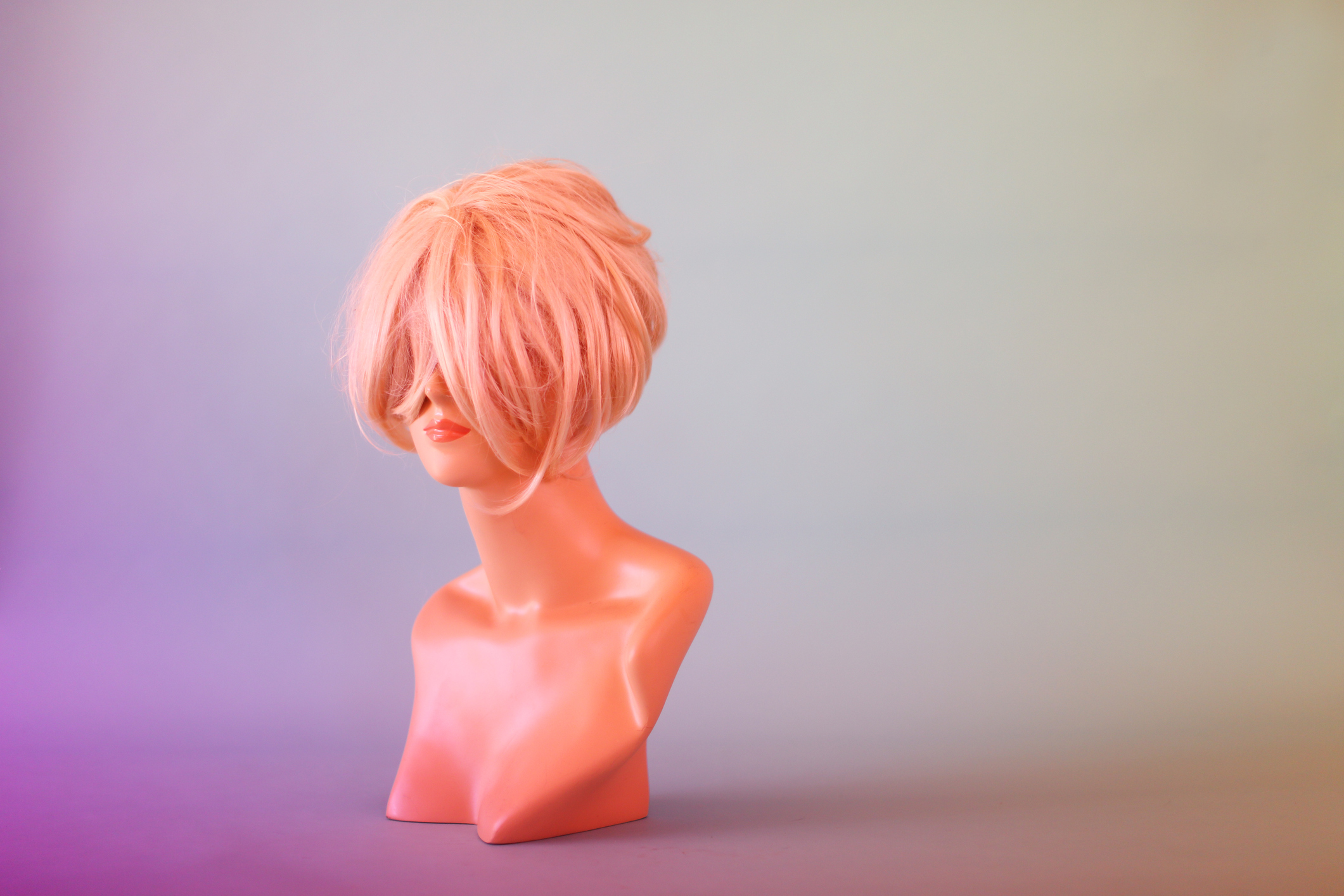 Mannequin Head Hiding Behind Blonde Wig