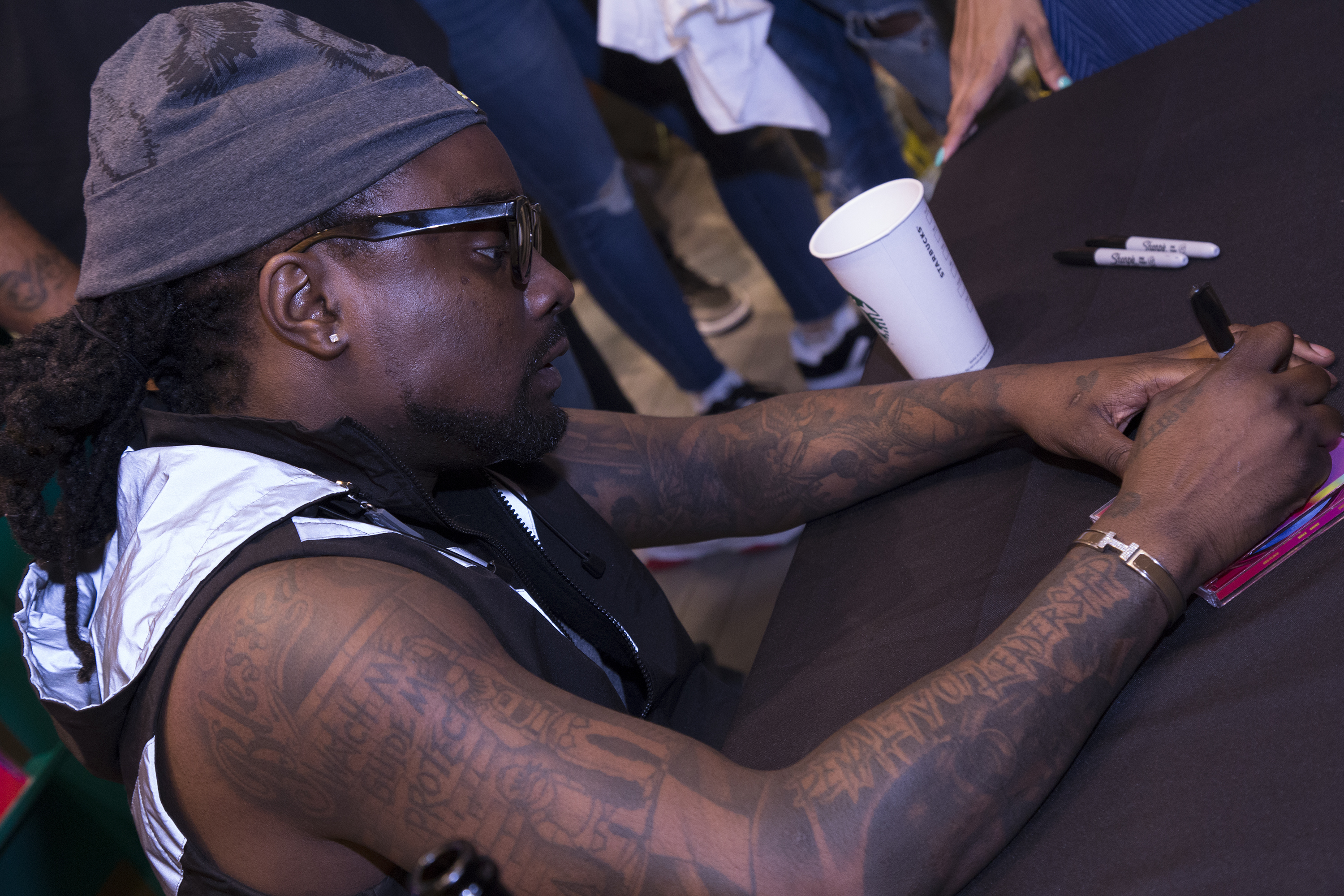 Wale Signs Copies Of His New Album 'Shine'