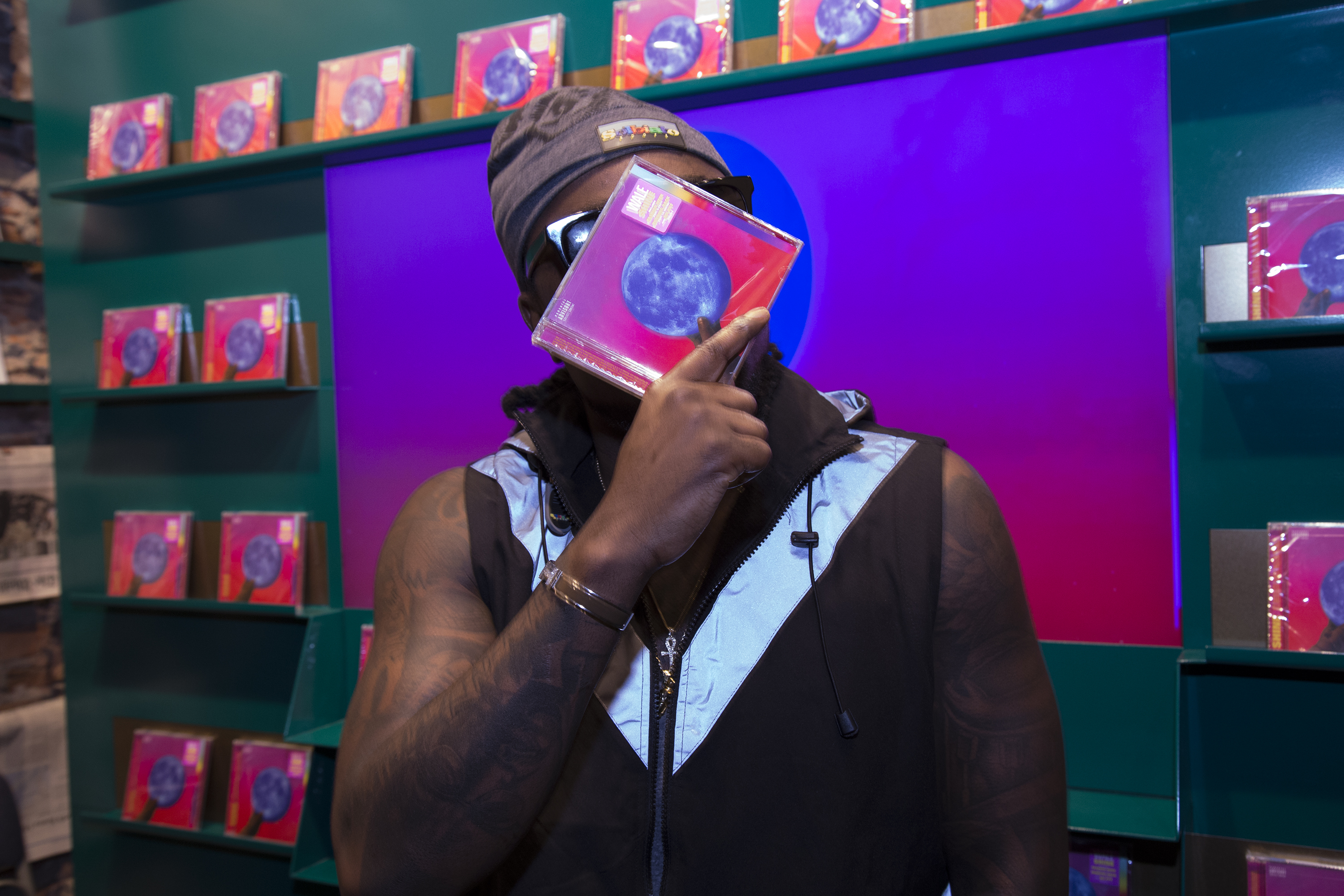 Wale Signs Copies Of His New Album 'Shine'