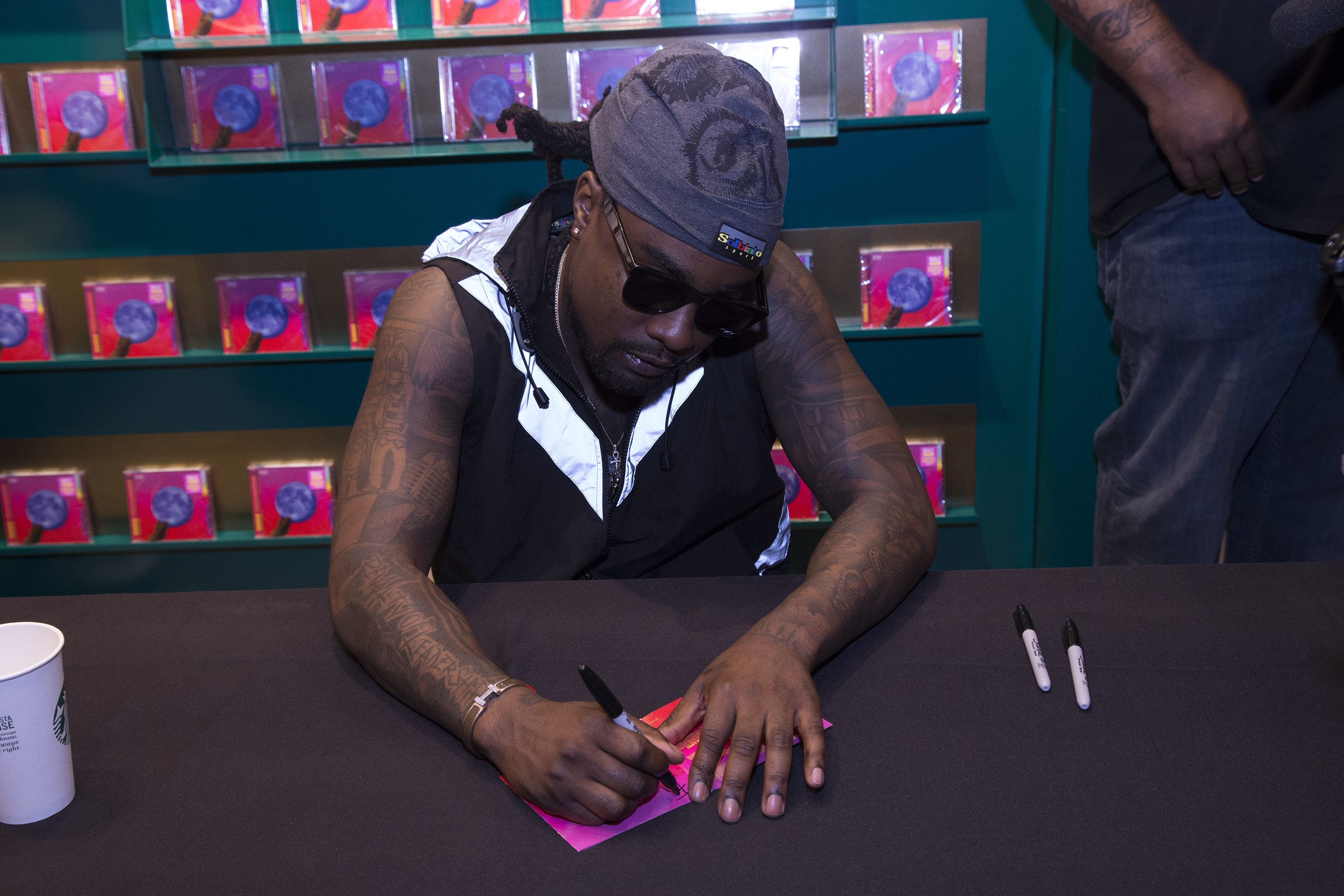 Wale Signs Copies Of His New Album 'Shine'