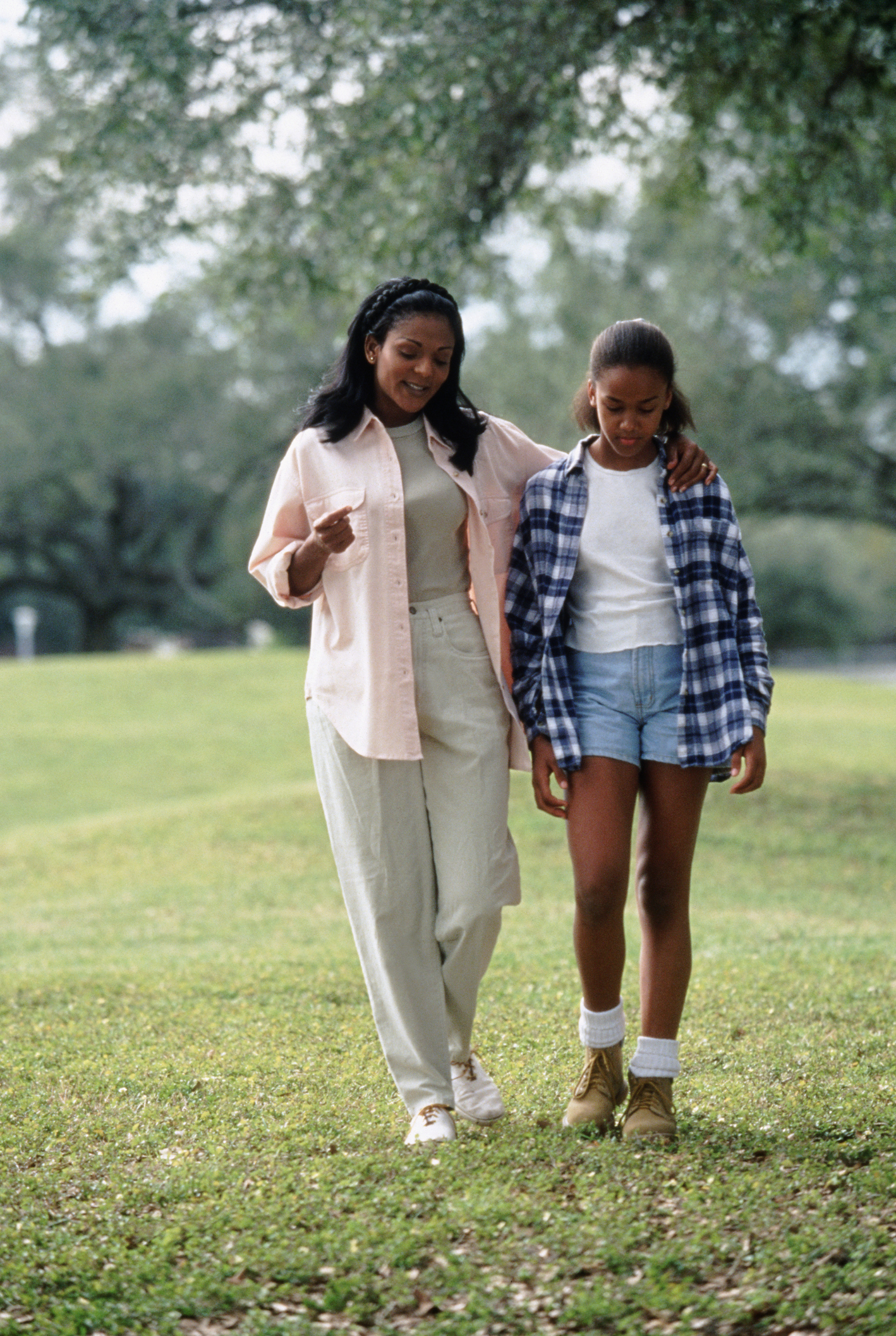 Mother and Daughter Walking in Park