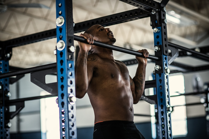 Man doing pullups at cross training gym