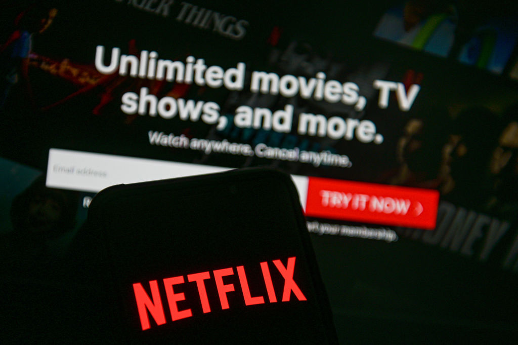 In this photo illustration a Netflix logo seen displayed on...