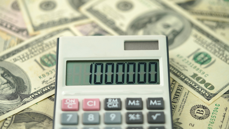 One million dollars calculator with American dollars concept photo